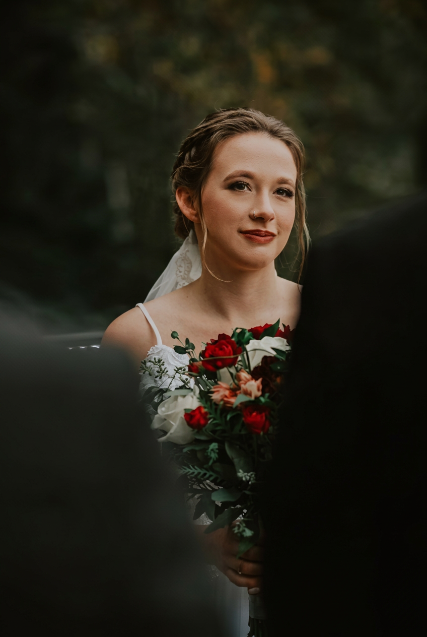 Bridal portrait with bouquet of red roses